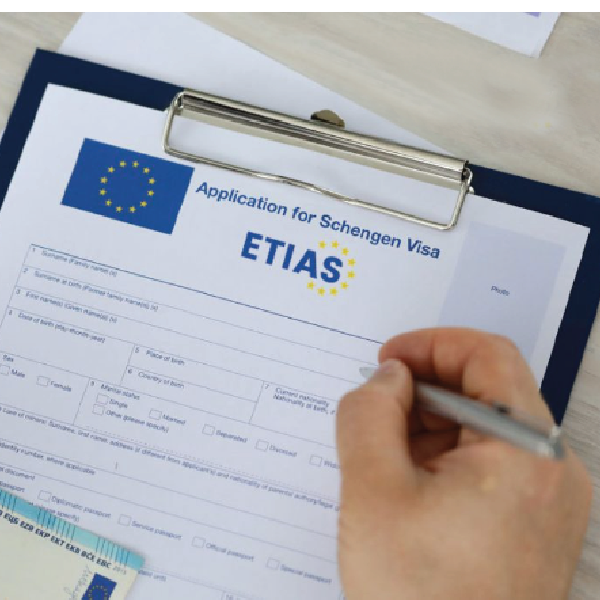 person filling etias schengen visa form              